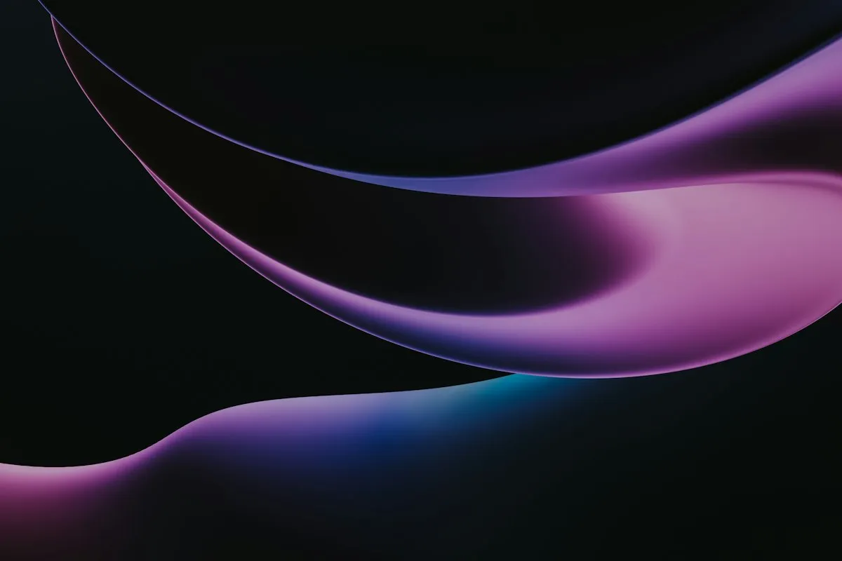 Ribbons of purple and pink light curving across a black background