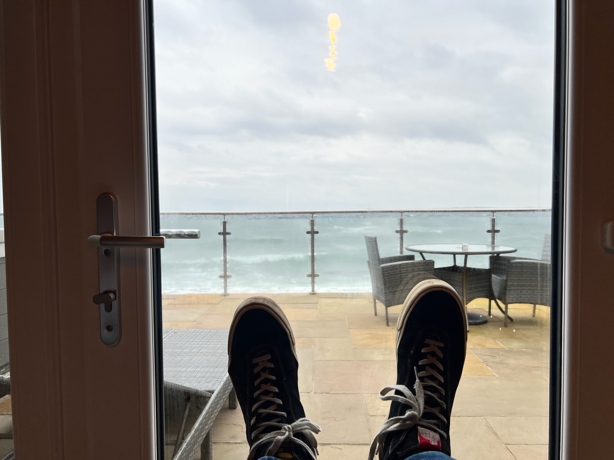 Feet up at Sinclair Bay in far north-east Scotland